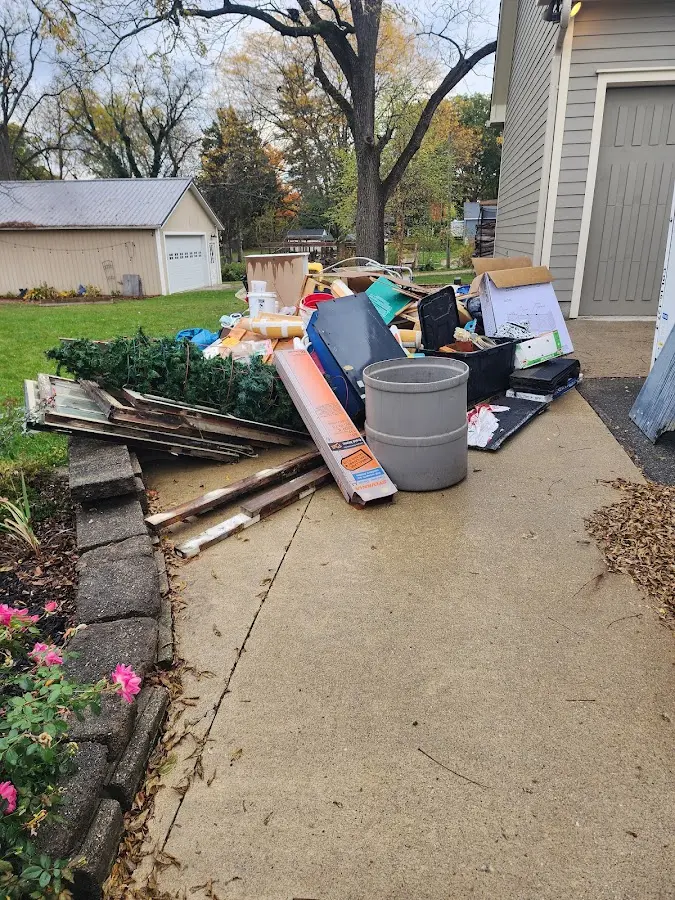 Dumpster being loaded with debris for 3 Yard Dumpster Rental in Apple Valley